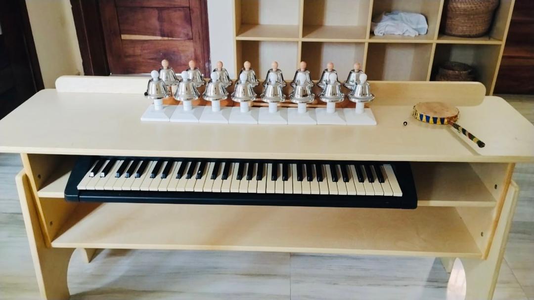 Montessori bells, piano, and tambourine used in French songs at OaksPlace